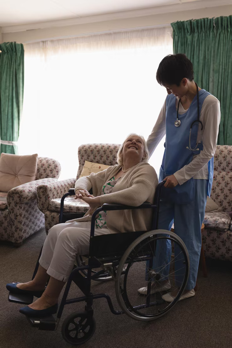 female-doctor-interacting-with-disabled-senior-woman-living-room_13339-348180