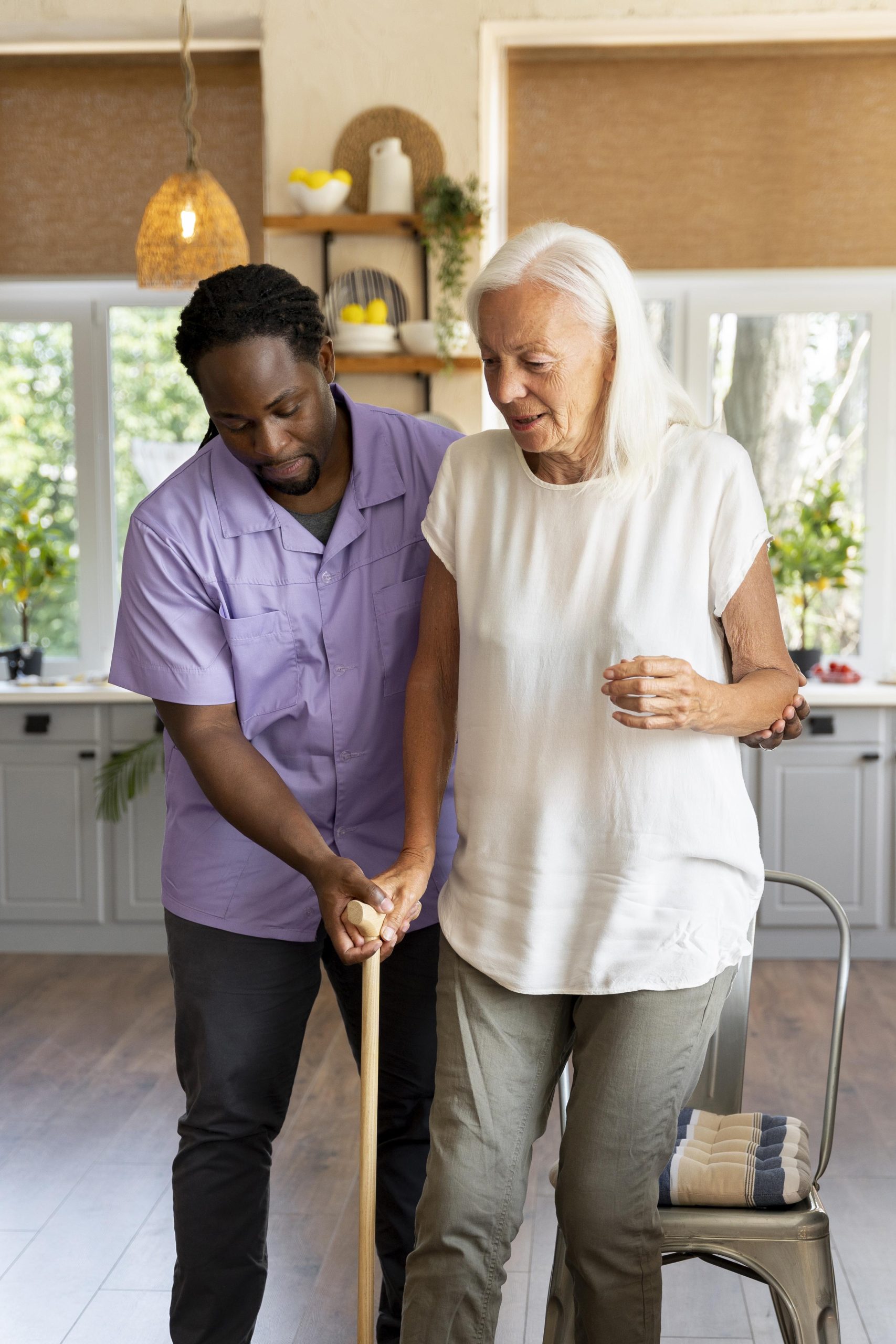 male-social-worker-taking-care-old-woman